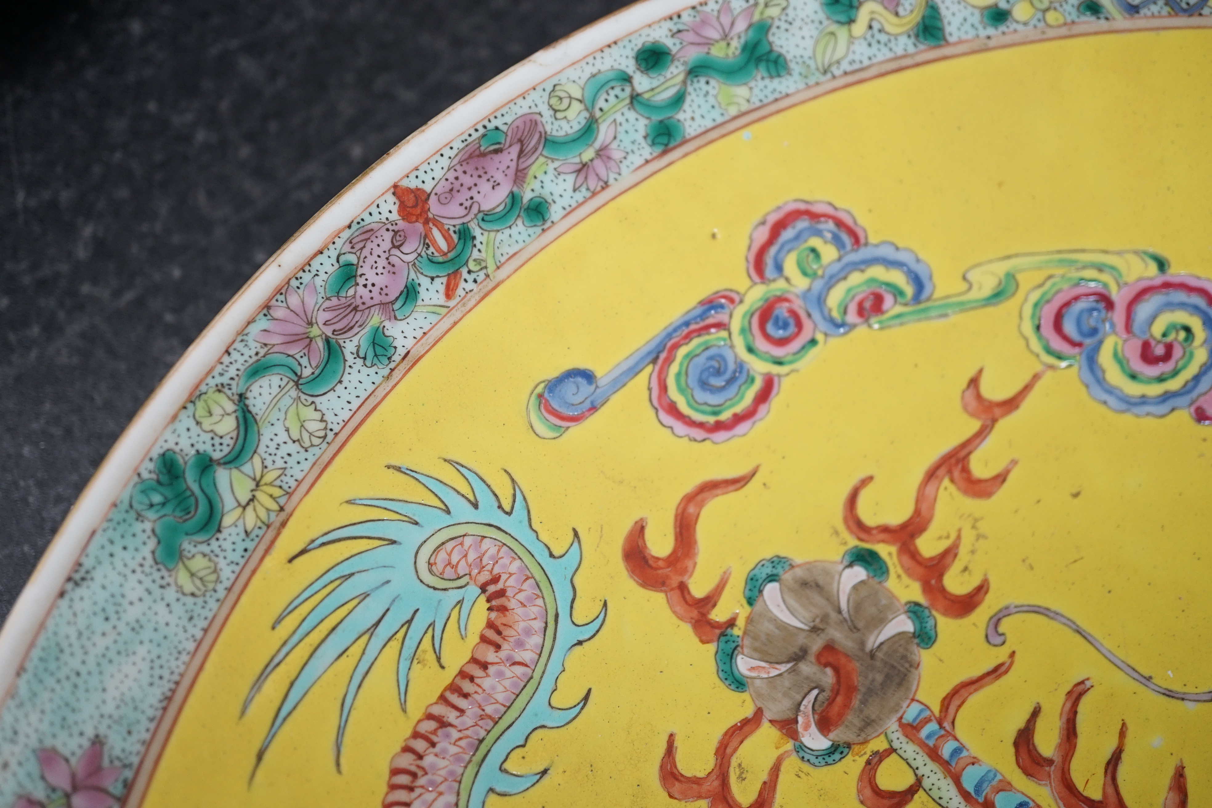A Chinese yellow ground ‘dragon’ dish, late 19th century, minor damage
